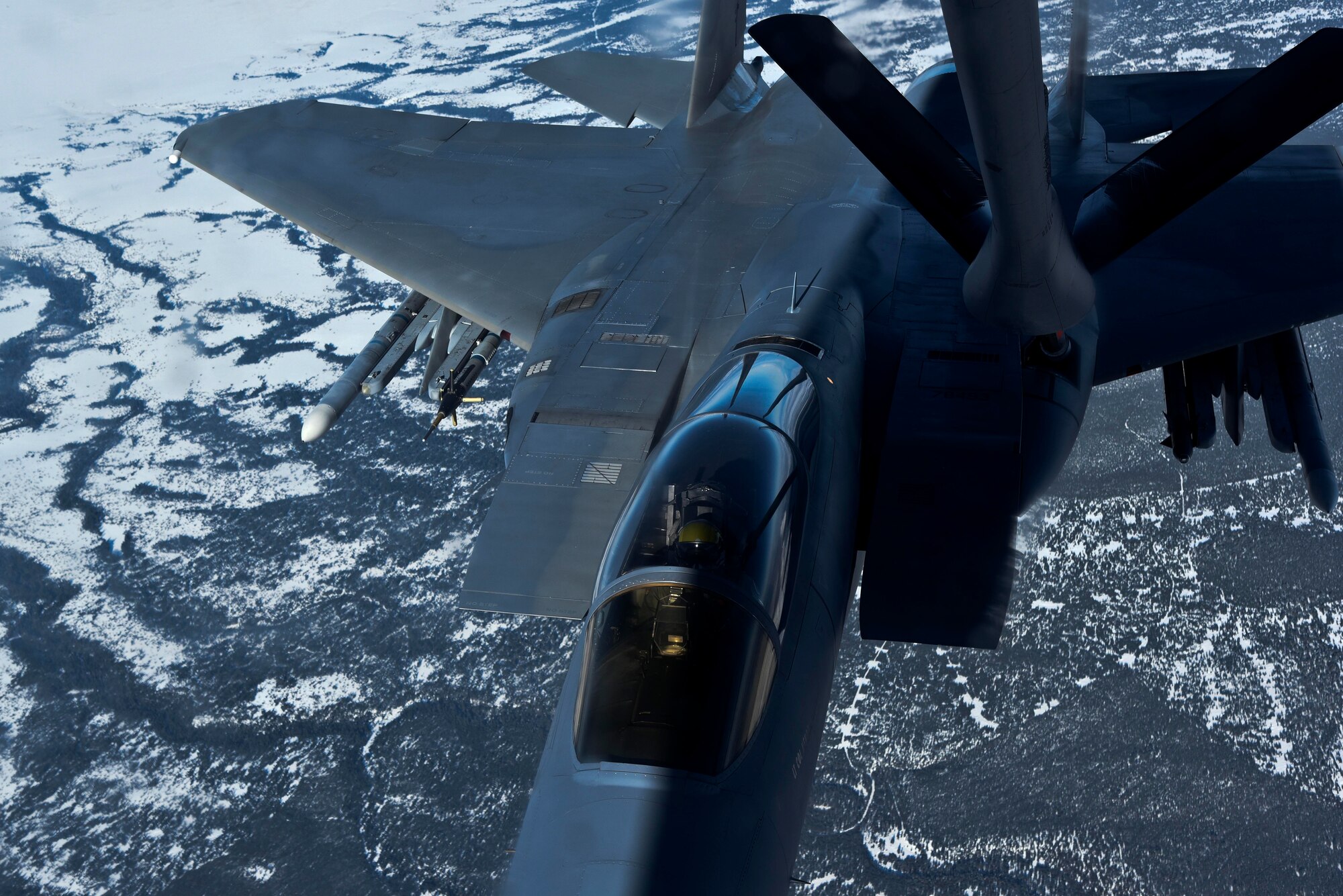 A KC-135 Stratotanker refuels an F-15 Eagle from Kingsley Field Air National Guard Base, Ore. during the Spokane-area Media Orientation Flight Jan. 8, 2016. Seven members from different Spokane media outlets participated in a orientation flight to include KREM 2 News, KXLY 4 News, KHQ 6 News, the Spokesman Review and Cheney Free Press Newspapers. (U.S. Air Force photo/ Senior Airman Janelle Patiño)