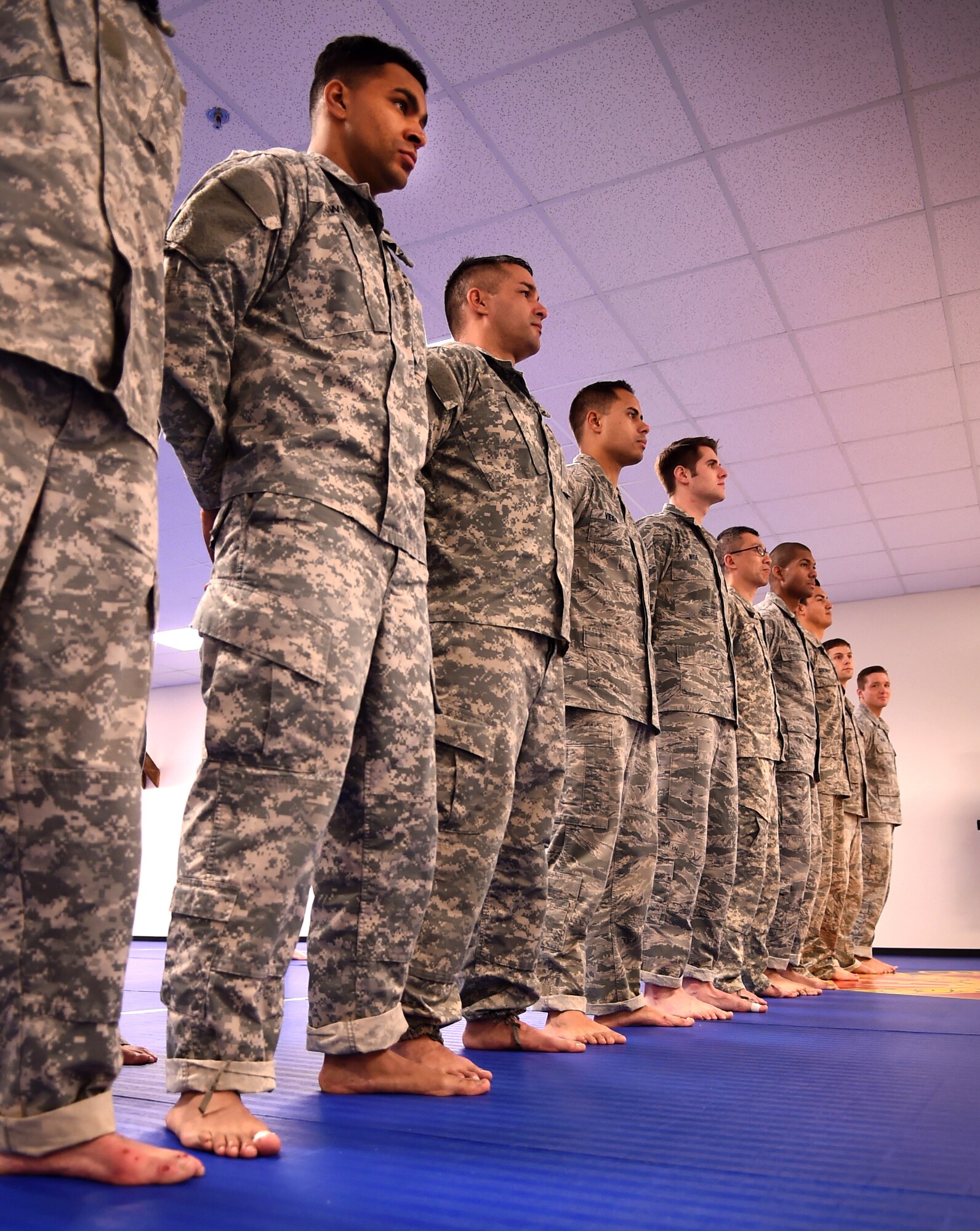 Students line up to practice for graduation during the Basic Combatives Course at Fort Belvoir, Jan. 8, 2016. The course produces well-rounded, skilled and more confident service members with approximately 10 students participating in the course at a time and 12 classes graduating per year. (U.S. Air Force photo by Senior Airman Mariah Haddenham/Released)

