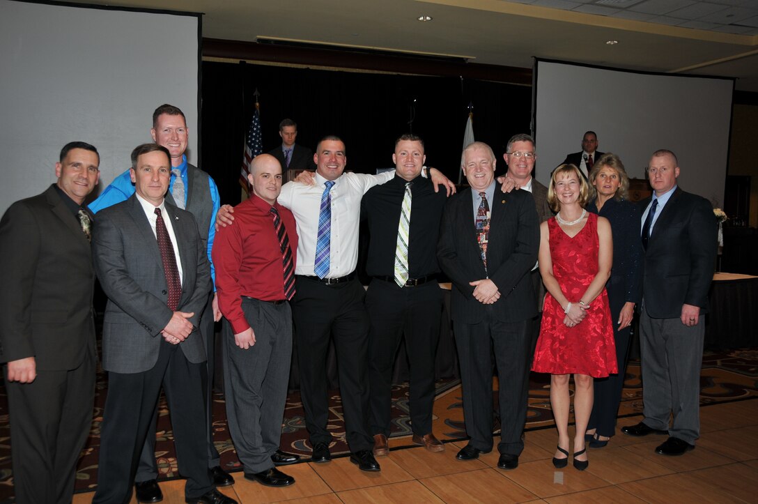 Four members of the 104th Fighter Wing Security Forces Squadron were recognized by the Air National Guard with 2015 Air National Guard Security Forces Annual individual awards, during the 42nd Annual Awards Ceremony, January 9, 2016 at the Springfield Sheraton, Springfield, Mass.  These awards recognize the outstanding achievement of our Airmen who demonstrated the highest levels of performance across the Air National Guard in their respective categories. From left to right: Chief Master Sgt. Thomas A. Puccio; Colonel James J. Keefe, Wing Commander for the 104th Fighter Wing; Master Sgt. Casey B. Walsh, Outstanding Air National Guard Security Forces  Senior Non-Commissioned Officer Award; Officer Christopher J. Krutka, Outstanding Air Reserve Component Security Forces Civilian Award; Staff Sgt. Steven Vigneault, Outstanding Air National Guard Security Forces  Flight-level Non-Commissioned Officer Award; Senior Airman Shane T. Coakley, Outstanding Air National Guard Security Forces Flight-level Airman Award;  Maj. Gen L. Scott Rice, Commander of the Massachusetts National Guard; Brig. Gen. Robert T. Brooks Jr., Assistant Adjutant General for Air, Massachusetts Air National Guard; Col. Anne Ware, 104th Fighter Wing  Mission Support Group Commander; Chief Master Sgt. Maryanne Walts, Command Chief of 104th Fighter Wing; Lt. Col. Steve Reynolds, 104th Fighter Wing Security Forces Squadron Commander (U.S. Air National Guard photo by Maj. Mary Harrington).  