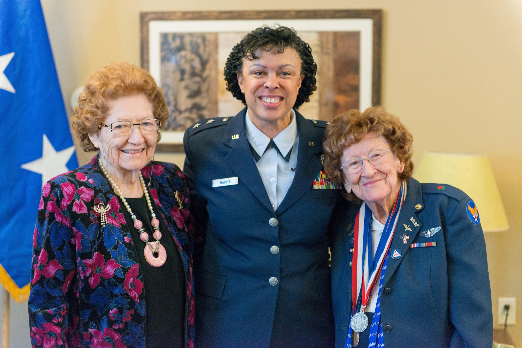 Ms. Cecelia Bell (left), Maj. Gen. Stayce Harris, 22nd Air Force commander (center), and Betty Strohfus (right) pose at the Congressional Gold Medal Ceremony in Faribault, Minn. on Jan. 7. Ms. Bell was presented with the Congressional Gold Medal for her service in the Civil Air Patrol during World War II. (U.S. Air Force photo by Captain William-Joseph Mojica)