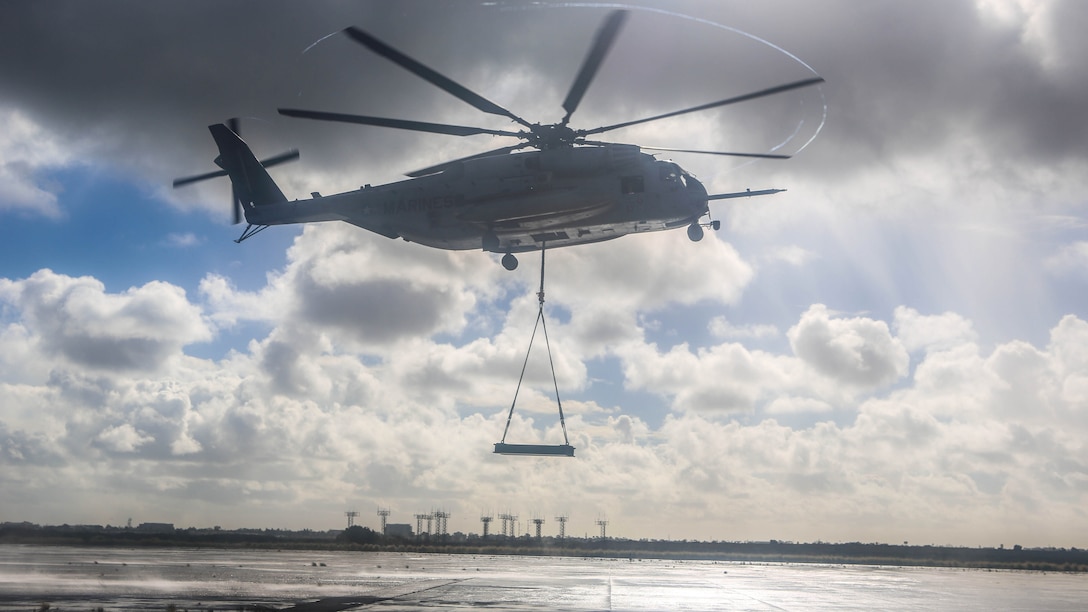 A CH-53E Super Stallion with Marine Heavy Helicopter Squadron 465 carries a simulated cargo load of 6,200 pounds aboard Marine Corps Air Station Miramar, Calif., Jan. 7. Marines with HMH-465 and Combat Logistics Battalion 11 practiced daytime external lift training to prepare for deliveries during deployments. 