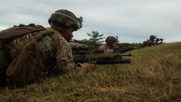 Marines get set to perform buddy rushes during squad attack training on Camp Schwab in Okinawa, Japan, Jan. 6, 2016. Marines with Bravo Company, Battalion Landing Team 1st Battalion, 5th Marines, 31st Marine Expeditionary Unit, conducted squad attack training in preparation for the MEU’s upcoming spring deployment. 