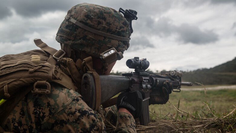 Lance Cpl. Jacob Cunningham fires at a target during squad attack training on Camp Schwab in Okinawa, Japan, Jan. 6, 2016. The Marines of Bravo Company, Battalion Landing Team 1st Battalion, 5th Marines, 31st Marine Expeditionary Unit, serve as the MEU’s boat company, specialized in amphibious raids using Combat Rubber Raiding Craft. Cunningham is a rifleman with Bravo Co., BLT 1/5, 31st MEU. (U.S. Marine Corps photo by Cpl. Samantha Villarreal/Released)