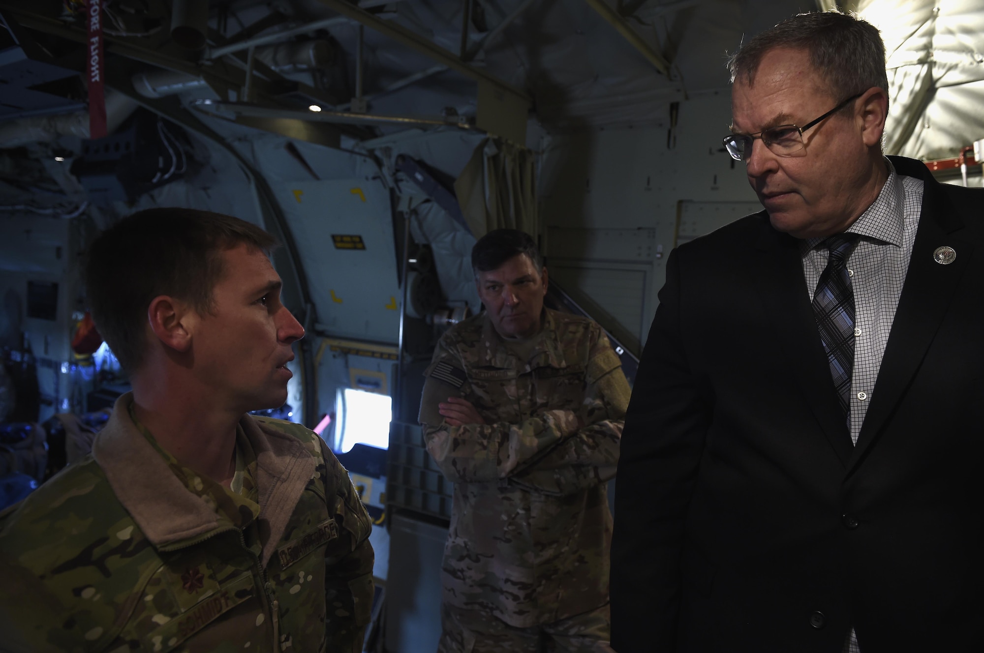 Deputy Secretary of Defense Bob Work speaks with Lt. Gen. Brad Heithold, commander of Air Force Special Operations Command, and Maj. Brian Schmidt, chief of weapons and tactics with the 1st Special Operations Group Detachment 2, during a tour of an AC-130J Ghostrider at Hurlburt Field, Fla., Jan. 6, 2016. The deputy secretary of defense visited Hurlburt to talk with troops and speak with Air Force Special Operations Command leadership. (U.S. Air Force photo by Airman 1st Class Kai White)
