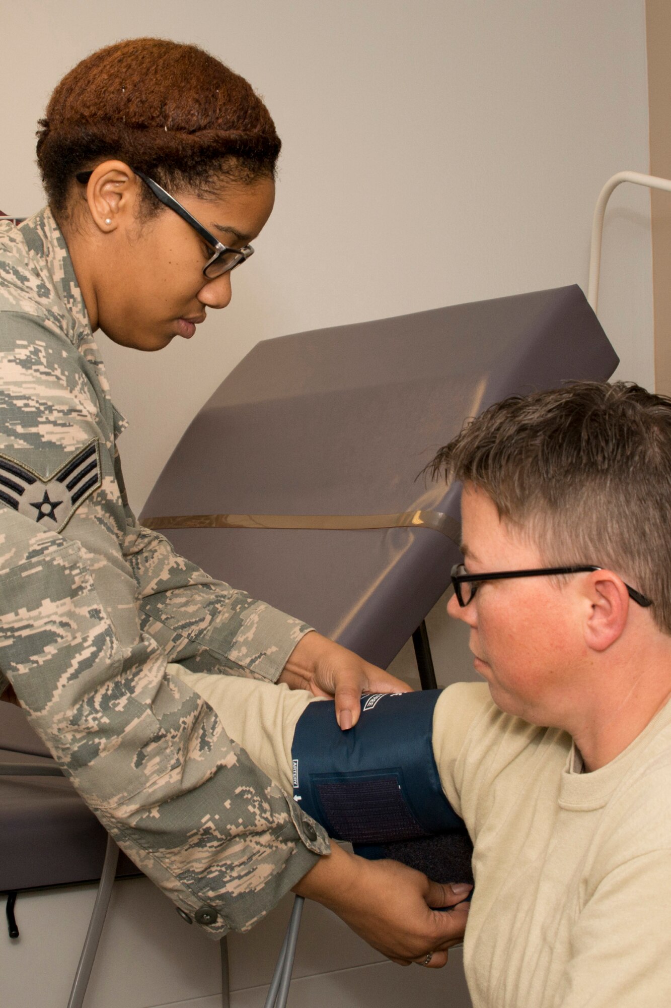 U.S. Air Force Reserve Senior Airman Kyla Mullens, an aerospace medical technician assigned to the 913th Aero Medical Squadron, takes the vital signs of Tech. Sgt. Heather Rudenick, in the medical clinic at Little Rock Air Force Base, Ark, Jan. 9, 2016. Rudenick, an aviation resource management journeyman with the 913th Operations Support Squadron, was taking her annual physical during the January Unit Training Assembly weekend. (U.S. Air Force photo by Master Sgt. Jeff Walston/Released)