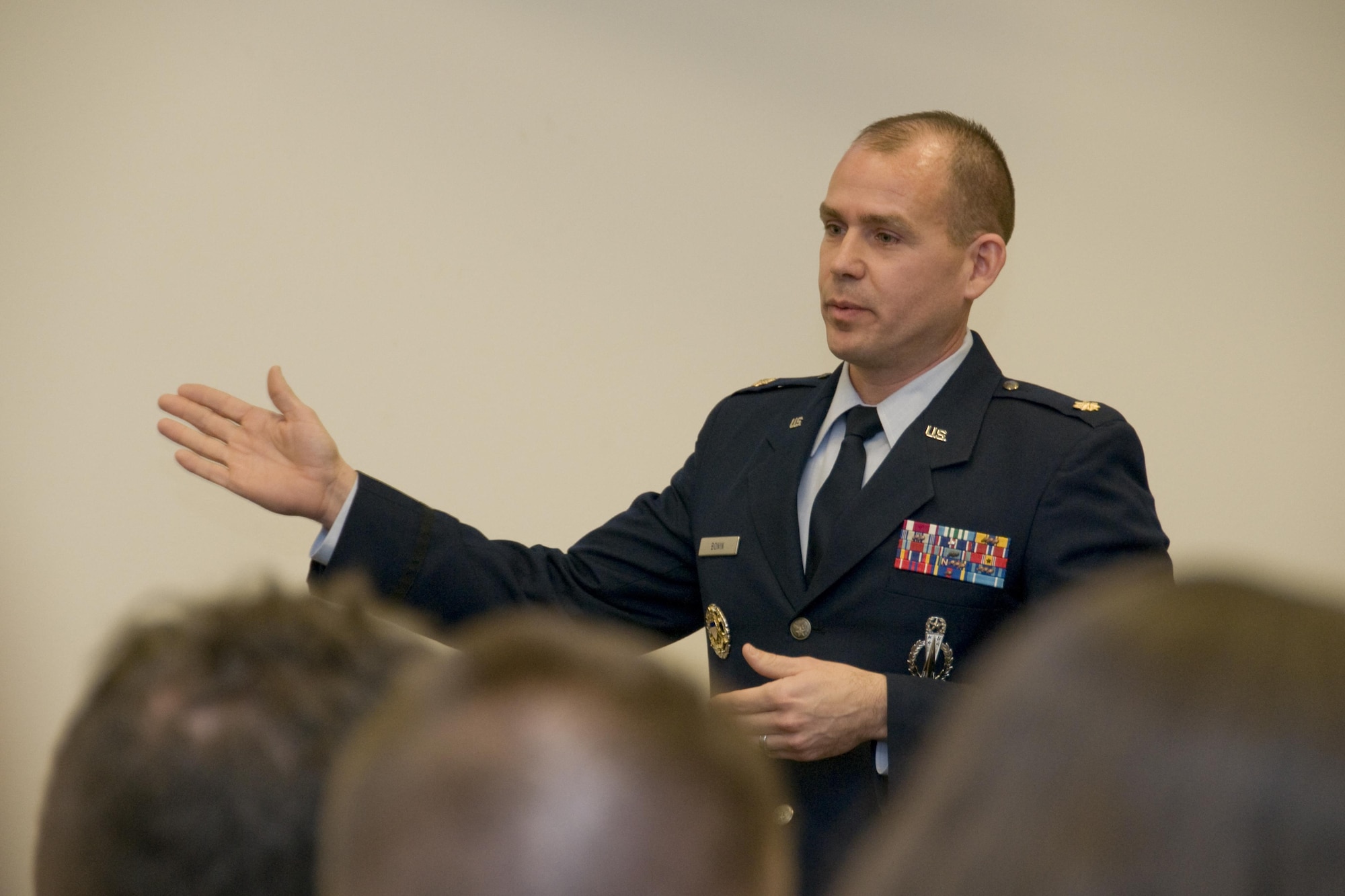 Maj. Stephen Bonin, a senior emergency actions officer with the National Military Command Center, briefs policymakers on the nuclear triad system during an Air Force 101 session at the Rayburn House Office Building in Washington, D.C., Jan. 11, 2015. The bi-monthly sessions educate policymakers on Air Force matters to help them make informed decisions. (U.S. Air Force photo/Sean Kimmons)