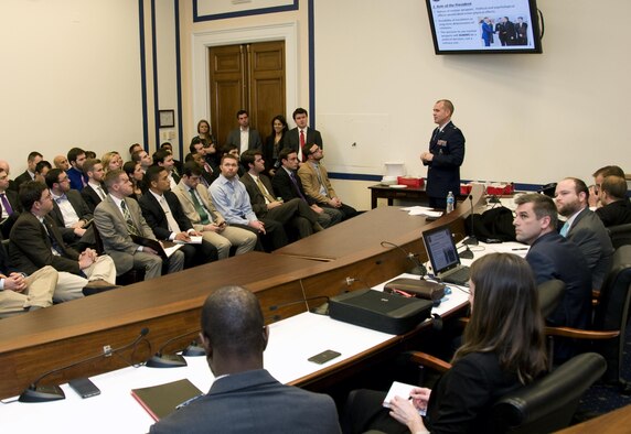 Maj. Stephen Bonin, a senior emergency actions officer with the National Military Command Center, briefs policymakers on the nuclear triad system during an Air Force 101 session at the Rayburn House Office Building in Washington, D.C., Jan. 11, 2015. The bi-monthly sessions educate policymakers on Air Force matters to help them make informed decisions. (U.S. Air Force photo/Sean Kimmons)