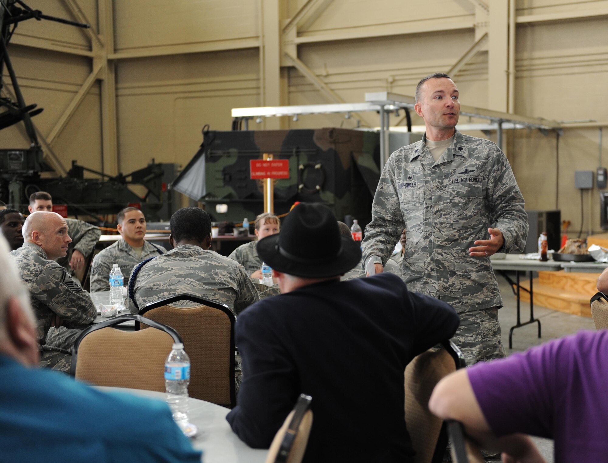 Lt. Col. Douglas Fowler, 338th Training Squadron commander, delivers remarks during a luncheon at Matero Hall Dec. 17, 2015, Keesler Air Force Base, Miss. Two Air Force Specialty Codes, 3D1X5 Ground Radar and 3D1X6 Airfield Systems, have been converted to 1C8X1 and 1C8X2, respectively. The 81st Training Group adjusted accordingly and realigned the 41-member flight from the 338th Training Squadron to the 334th Training Squadron effective Jan 4, 2016. The 338th TRS staff held a flight transition luncheon to thank them for their contributions and dedicated service to the unit. (U.S. Air Force photo by Kemberly Groue)