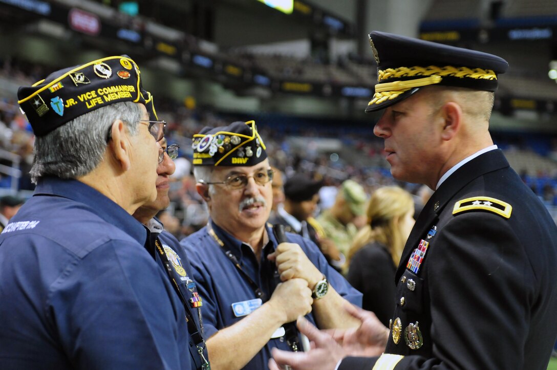 Army Maj. Gen. Jeffery Snow, right, commander, U.S. Army Recruiting Command, talks to veterans at the Alamodome before the 2016 All-American Bowl in San Antonio, Texas, Jan. 9, 2016. U.S. Army Photo by Sgt. Bethany L. Huff