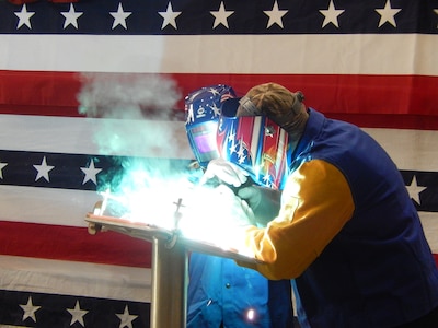 MOBILE, Alabama (Jan. 11, 2016) A welder authenticates the keel by welding the initials of the ship's sponsor, former mayor of Tulsa, Oklahoma Mrs. Kathy Taylor, onto the keel plate of the U.S. Navy's sixteenth littoral combat ship, the future USS Tulsa (LCS 16). The keel laying is the formal recognition of the start of the ship and module construction process. (U.S. Navy Photo)