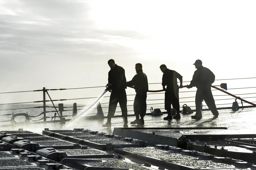 U.S. sailors use freshwater to wash the deck of the USS Ross in the Mediterranean Sea, Jan. 10, 2016. U.S. Navy photo by Petty Officer 2nd Class Justin Stumberg 