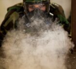 Lance Cpl. Jamie Roper, a chemical, biological, radiological, and nuclear Marine with Headquarters Company, 2nd Marine Logistics Group, disperses chlorobenzylidene malononitrile, or CS gas, in preparation for gas chamber bi-annual qualification at Camp Lejeune, N.C., Jan.8.  The chamber is a routine exercise to ensure the durability of each Marine's gear while exposed to CS gas. (U.S. Marine Corps photo by Lance Cpl. Preston McDonald/Released)