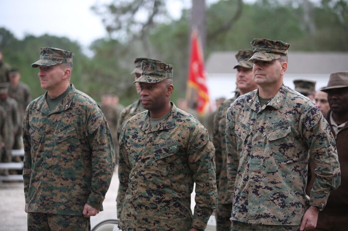 Senior leadership from 2nd Marine Logistics Group stand at attention at the start of the ribbon cutting ceremony, unveiling a newly renovated training facility, at Camp Lejeune, N.C., Jan. 6, 2016. The site is to be used for future Corporals Courses and by 2d MLG Marines and sailors. (U.S. Marine Corps photo by Lance Cpl. Miranda Faughn/Released)