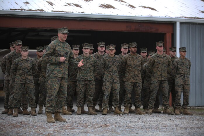 Brig. Gen. Charles Chiarotti, commanding general for 2nd Marine Logistics group, recognizes the group of Marines who helped rebuild the unit’s new Corporals Course facility, during its unveiling at Camp Lejeune, N.C., Jan. 6, 2016. The buildings on the site were supposed to be demolished, but were renovated for their potential to be used as a training facility. (U.S. Marine Corps photo by Lance Cpl. Miranda Faughn/Released)