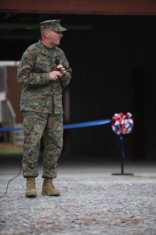 Brig. Gen. Charles Chiarotti, commanding general for 2nd Marine Logistics Group, speaks to the Marines and sailors attending the ribbon cutting ceremony to unveil the new Corporals Course training facility at Camp Lejeune, N.C., Jan. 6, 2016. Chiarotti spoke with them about the importance of non-commissioned officers and training at all stages of their careers.  (U.S. Marine Corps photo by Lance Cpl. Miranda Faughn/Released)