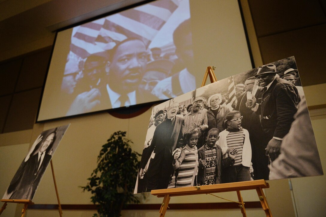 Photos from the life of Dr. Martin Luther King, Jr. are displayed at the MLK Day ceremony at the Leadership Development Center Jan. 11, 2016, on Buckley Air Force Base, Colo. The ceremony featured readings of Dr. King’s speeches, videos, and southern style food. (U.S. Air Force photo by Staff Sgt. Darren Scott)