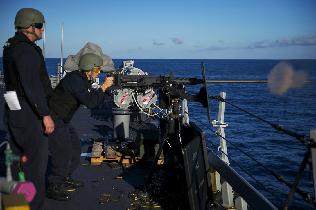 U.S. Navy Petty Officer 2nd Class Michael Goodspeed fires a .50-caliber machine gun during a weapons shoot aboard the USS Carney in the Mediterranean Sea, Jan. 8, 2016. Carney, a guided-missile destroyer, is patrolling in the U.S. 6th Fleet area of operations to support U.S. national security interests in Europe. U.S. Navy photo by Petty Officer 1st Class Theron J. Godbold