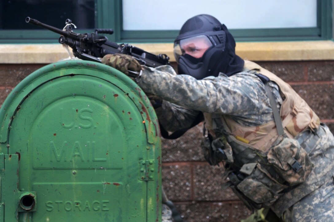 A New York Army National Guardsman aims at opposing forces while providing security during tactical training at the New York Police Department training facility and range at Rodman’s Neck, New York, Jan. 9, 2016. New York Army National Guard photo