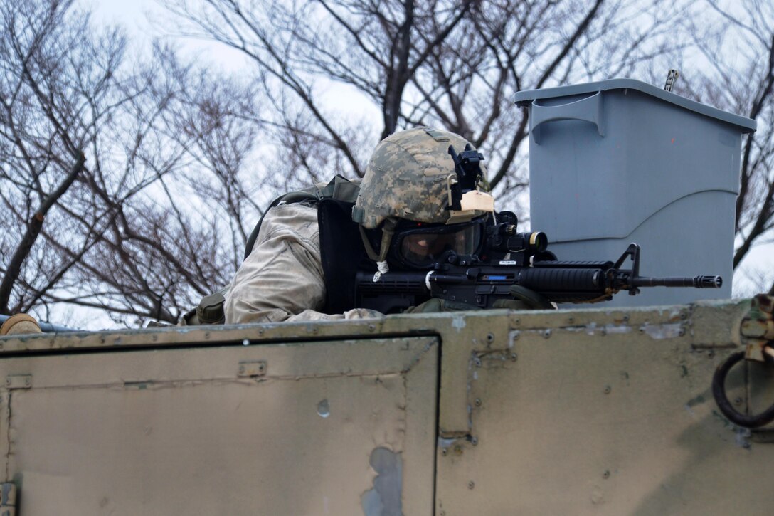 A New York Army National Guardsman provides security during tactical training at the New York Police Department training facility and range at Rodman’s Neck, New York, Jan. 9, 2016. New York Army National Guard photo