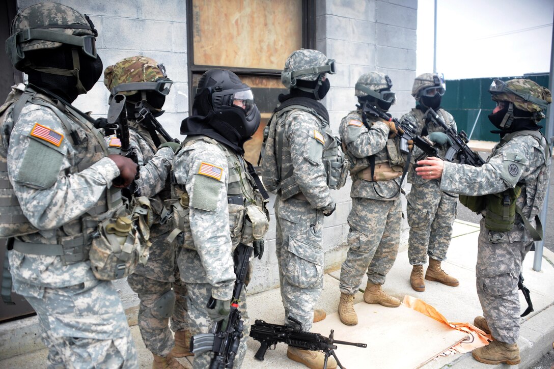 New York Army National Guardsmen conduct an after action review after completing their tactical training at the New York Police Department training facility and range at Rodman’s Neck, New York, Jan. 9, 2016. New York Army National Guard photo