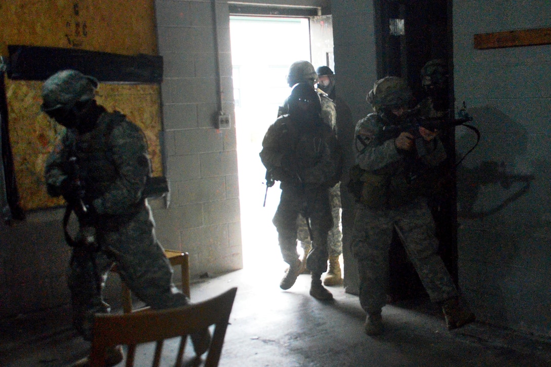 New York Army National Guardsmen search and secure a building during tactical training at the New York Police Department training facility and range at Rodman’s Neck, New York, Jan. 9, 2016. New York Army National Guard photo