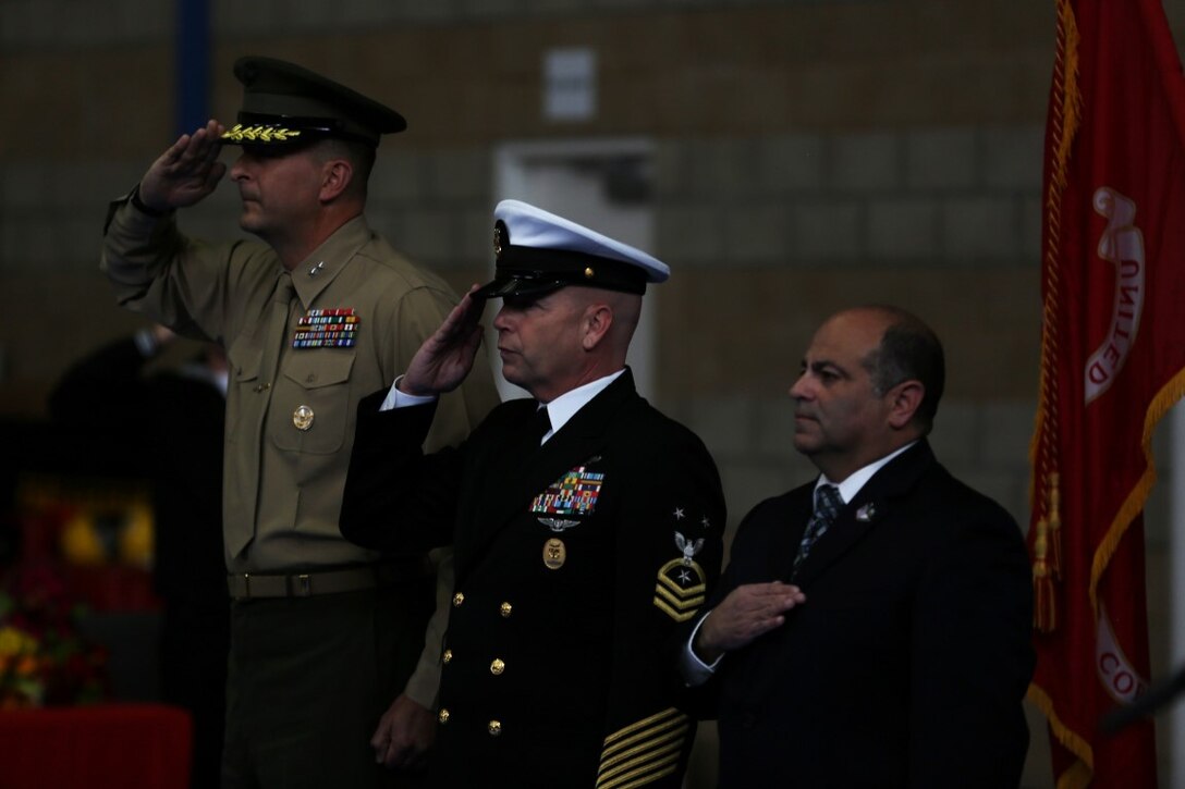 Master Chief Petty Officer Robert Lemons (center), the command master chief of the 1st Marine Division, salutes alongside Maj. Gen. Daniel O’Donohue (left), commanding general of the 1st Mar. Div., during Lemons’ retirement ceremony aboard Marine Corps Base Camp Pendleton, Calif., Jan. 8, 2016. Lemons enlisted in the U.S. Navy in 1986 and served a majority of his time in the service as a corpsman.