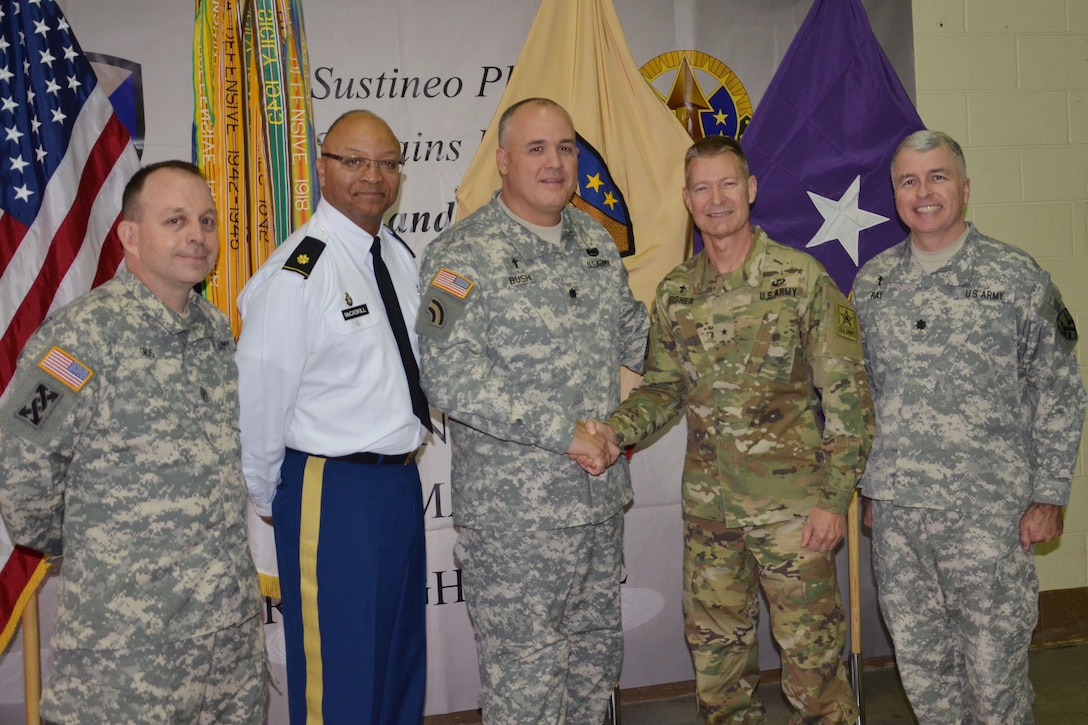 Chaplain (Brig. Gen.) Carlton Fisher, assistant chief of chaplains for mobilization and readiness in the Office of the Chief of Chaplains (OCCH) at the Pentagon, congratulates Chaplain (Lt. Col.) Jeffery Bush, command chaplain of the Army Reserve Sustainment Command of Birmingham during Bush’s promotion ceremony. Also pictured from left to right: Sgt. Maj. Ward Gros, chaplain assistant with the 377th Theater Sustainment Command, Chaplain (Maj.) Henry McCaskill Jr., command chaplain of the Deployment Support Command, Chaplain (Lt. Col.) Jeffery Bush, command chaplain of the Army Reserve Sustainment Command, Chaplain (Brig. Gen.) Carlton Fisher, assistant chief of chaplains for mobilization and readiness in the Office of the Chief of Chaplains (OCCH) at the Pentagon, and Chaplain (Lt. Col.) Brian Ray, command chaplain for the 377th Theater Sustainment Command of New Orleans, Louisiana.