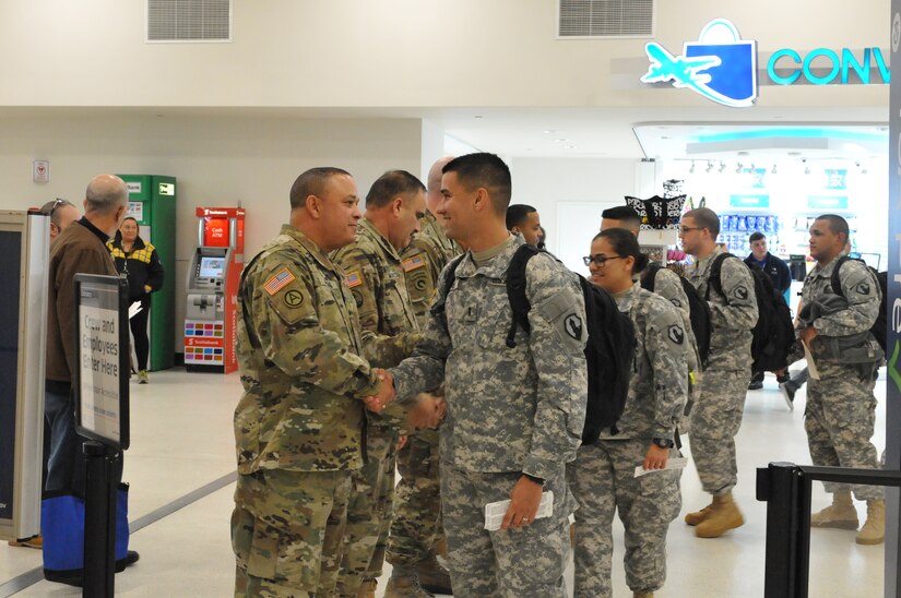 Brig. Gen. Jose R. Burgos, 1st Mission Support Command Commanding General, bids farewell to Soldiers of the 271st HR CO (Postal) as they head to their mobilization training in Texas on January 12, 2016.