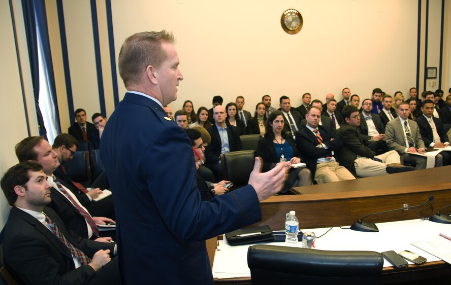 Maj. Nathan Perry, the chief of airborne capabilities for Air Staff 10 that handles the Air Force’s nuclear mission, discusses nuclear operations with policymakers during an Air Force 101 session at the Rayburn House Office Building in Washington, D.C., Jan. 11, 2015. The bi-monthly sessions educate policymakers on Air Force matters to help them make informed decisions. (U.S. Air Force photo/Sean Kimmons)