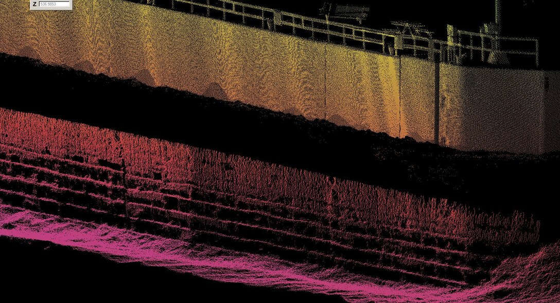 A multibeam sonar was used initially to inspect the underwater wooden cribbing that supports the concrete guidewall at Locks and Dam 15. The cribbing, shown here near the bottom of the image as alternating black and colored stripes, did not appear to be damaged and therefore a dive team was called in for further investigation. 