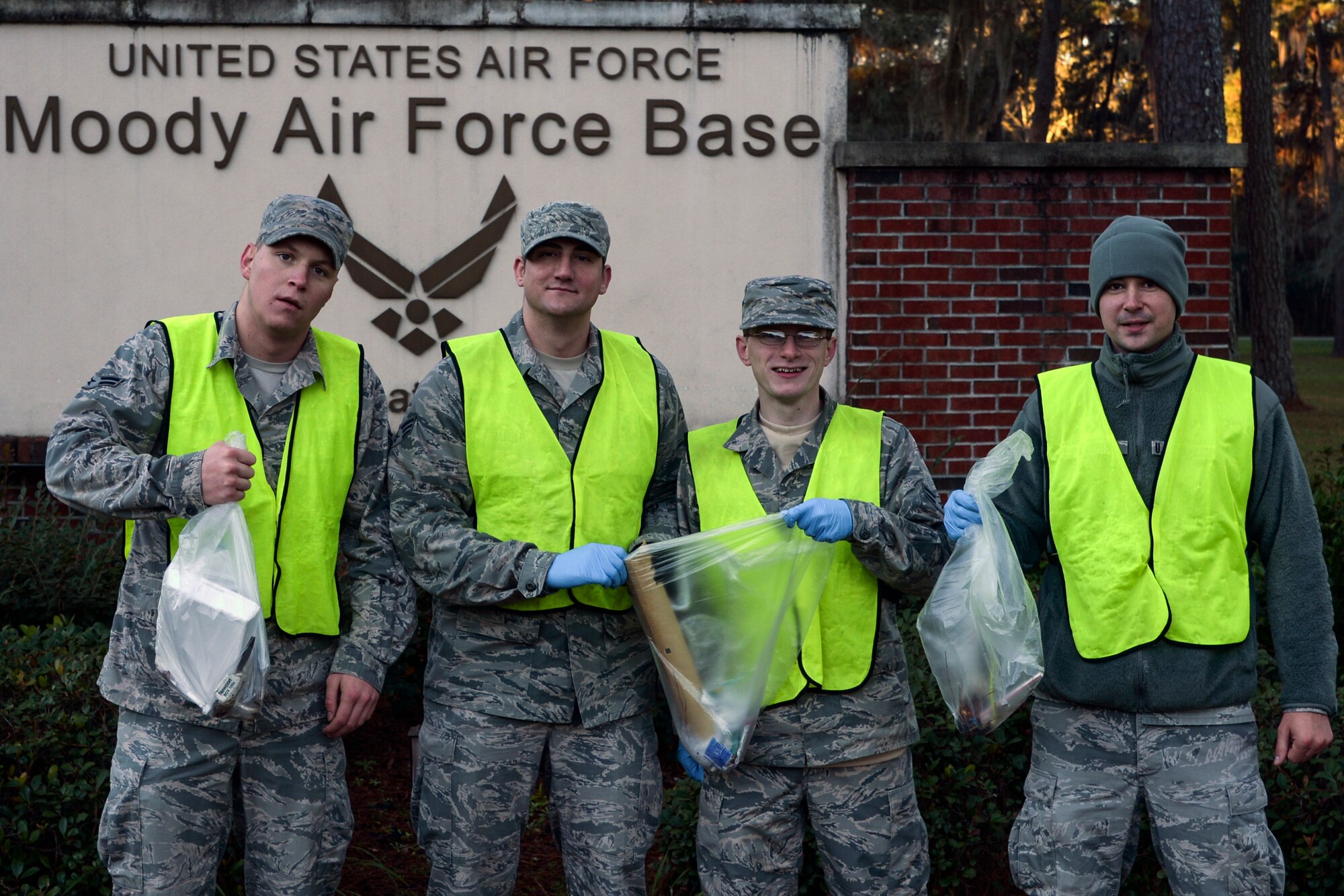 U.S. Air Force Airmen from the 23d Fighter Group pose for a photo after a Pride Patrol clean-up, Jan. 12, 2016, at Moody Air Force Base, Ga. Pride Patrols afford Airmen an opportunity to get out into the community and volunteer. (U.S. Air Force photo by Airman 1st Class Janiqua P. Robinson/Released)