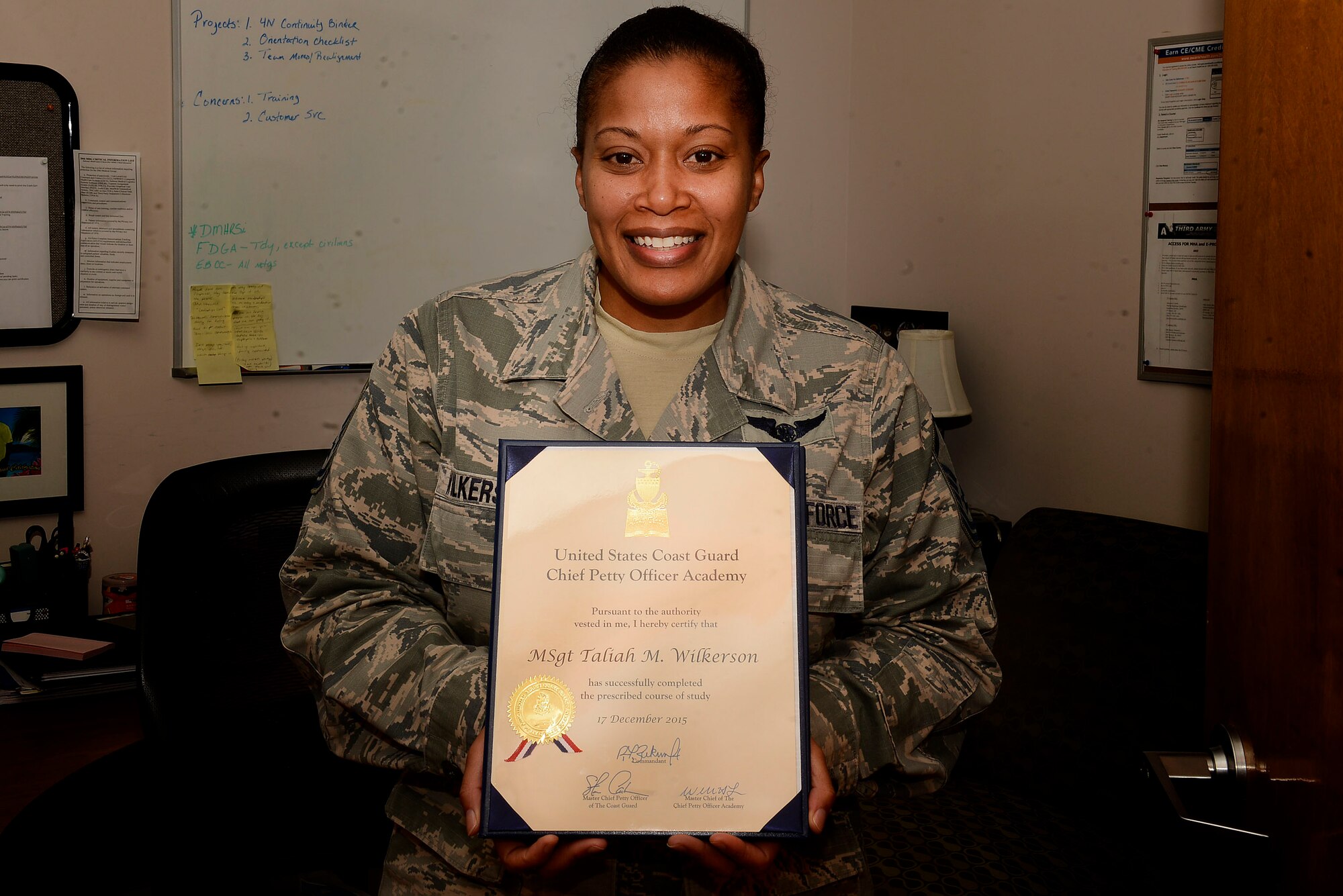 U.S. Air Force Master Sgt. Taliah Wilkerson, 20th Medical Operations Squadron family health flight chief, poses with her “Altus Tendo” award at Shaw Air Force Base, S.C., Jan. 12, 2015. The “Altus Tendo” is the Chief Petty Officer Academy most prestigious award, equivalent to the Air Force John Levitow award. Wilkerson attended the Coast Guard CPOA in Petaluma, California, from Nov. 16 to Dec. 17. (U.S. Air Force photo by Airman 1st Class Christopher Maldonado)