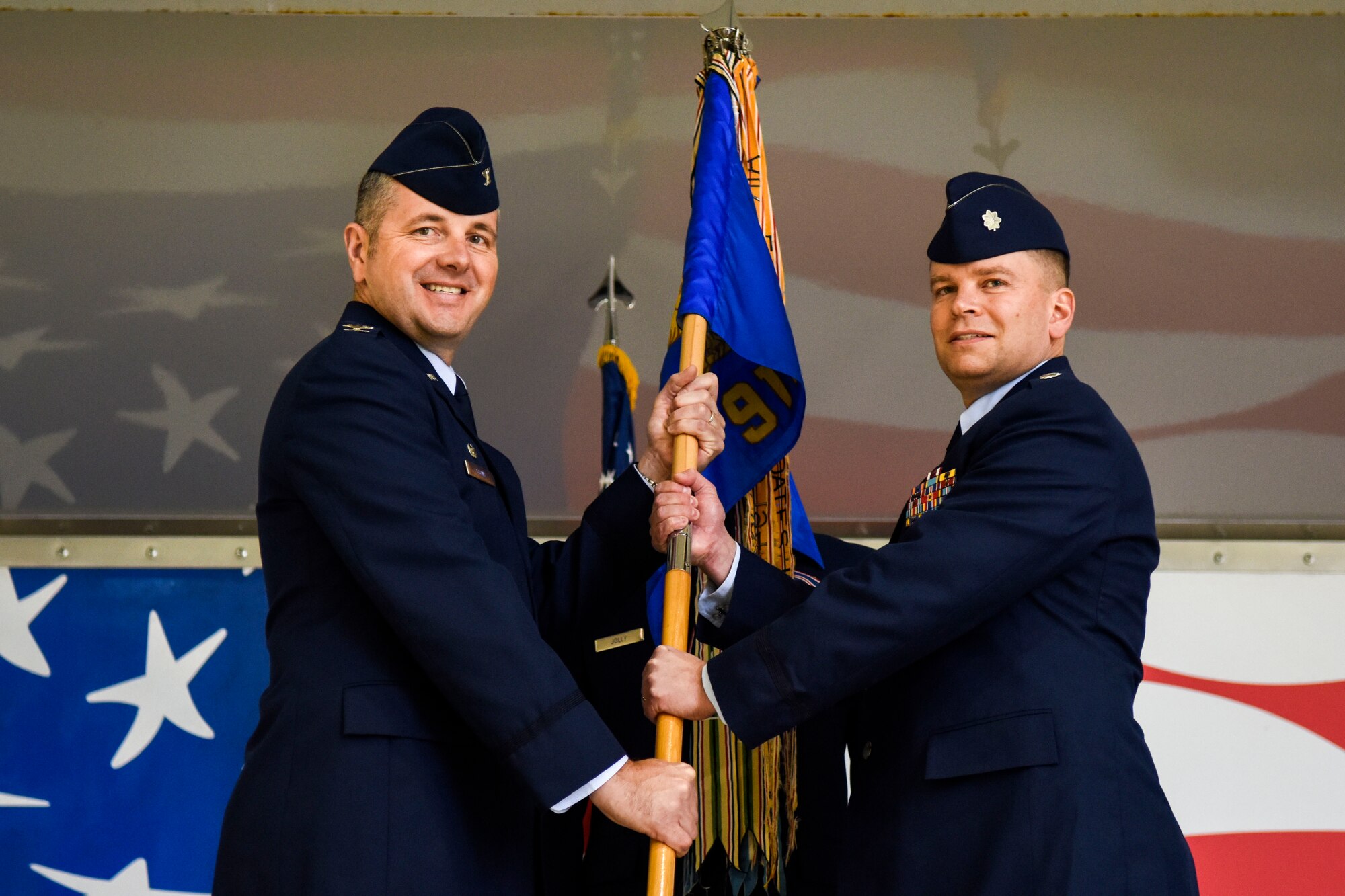 Col. William Stowe III, 6th Operations Group commander, hands the guidon to Lt. Col. Philip Morrison, incoming 911th Air Refueling Squadron commander, Jan. 8, 2016, at Seymour Johnson Air Force Base, North Carolina. Morrison previously served as the 911th ARS operations officer. (U.S. Air Force photo/Airman Shawna L. Keyes)