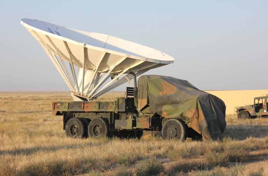 A five-ton vehicle carrying a 30-foot radar dish stands ready at Saylor Creek Range Complex, Idaho. Contract range personnel modified the vehicle to create a target capable of being relocated for different mission needs. (Courtesy photo)