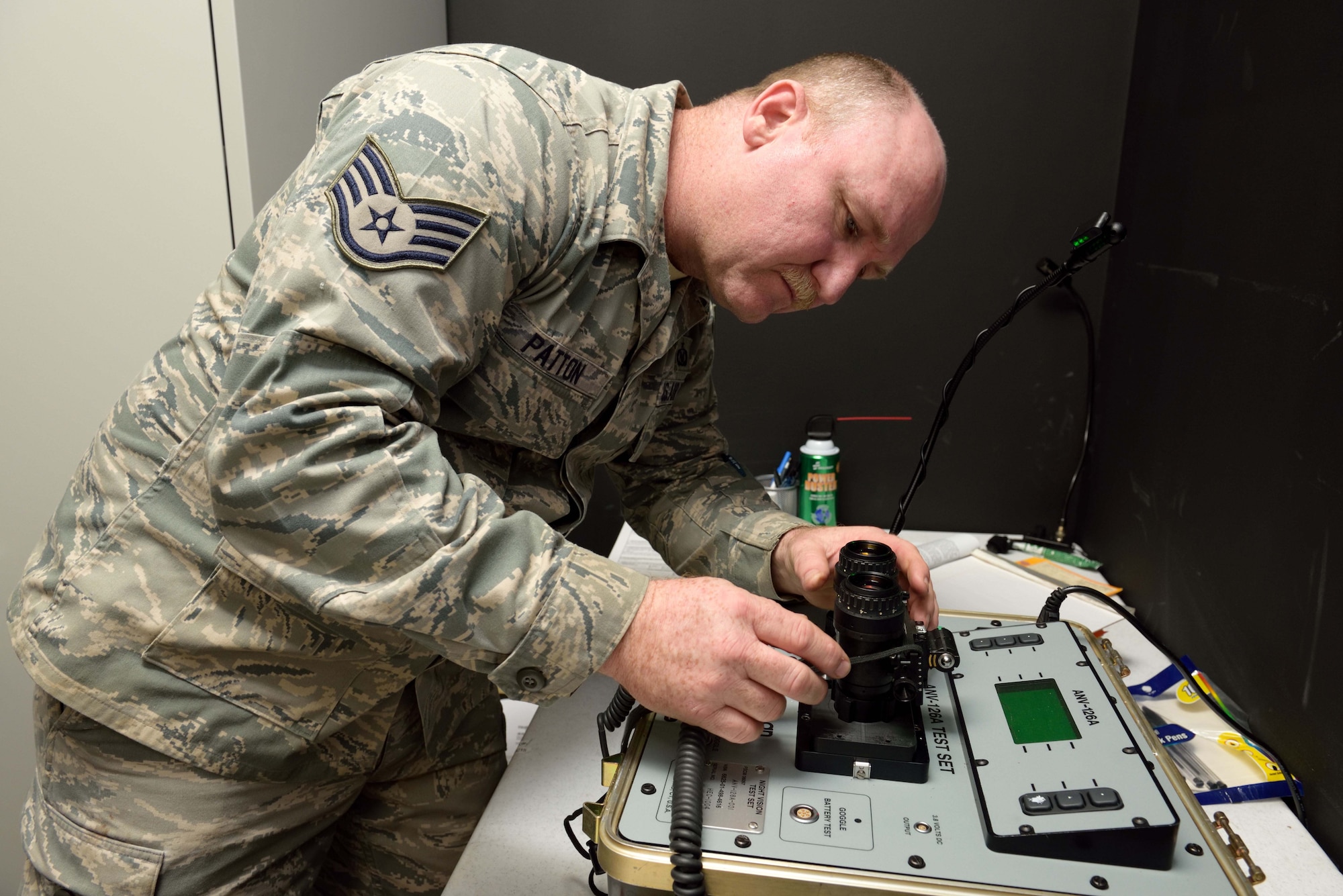 Staff Sgt. Ronald Patton, 403rd Operational Support Squadron aircrew flight equipment craftsman, prepares to inspect a set of night vision goggles used by 815th Airlift Squadron flight crews at Keesler Air Force Base, Mississippi, Jan. 10, 2016. Patton was one of several 403rd Wing members who served in the military during Operations Desert Shield and Desert Storm 25 years ago. (U.S. Air Force photo/Tec. Sgt. Ryan Labadens)