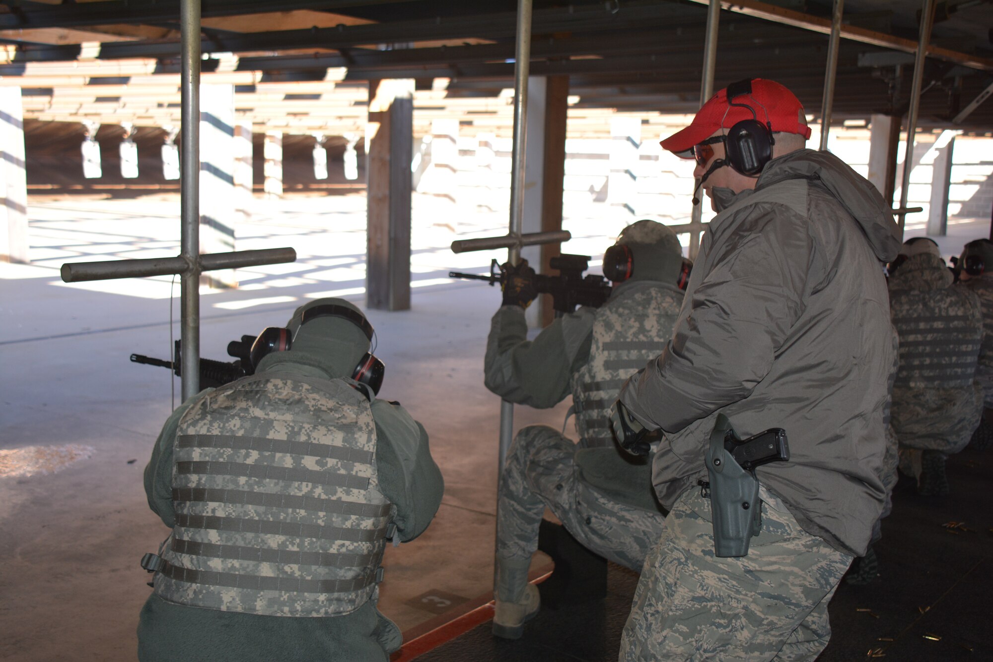 A Combat Arms Training and Maintenance instructor from the 507th Security Forces Squadron observes Airmen during M-4 carbine qualification Jan. 10, 2016, at the firing range at Tinker Air Force Base, Okla. CATM conducts training on proper use and maintenance of firearms during each Unit Training Assembly, ensuring Reservists in the 507th Air Refueling Wing are qualified and ready to deploy at a moment’s notice. (U.S. Air Force photo/Tech. Sgt. Charles Taylor)
