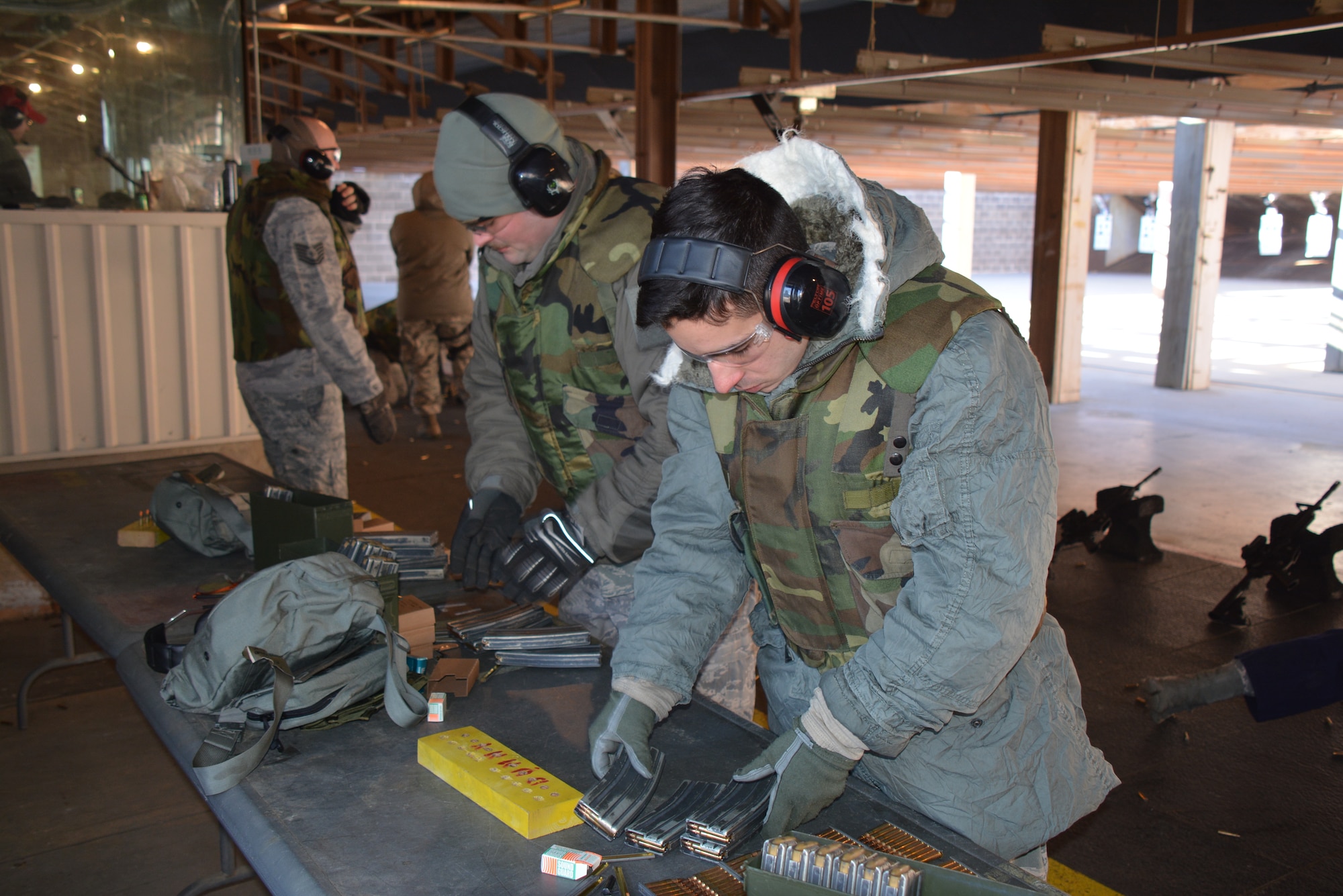 160110-F-OW851-026
Airmen from the 507th Air Refueling Wing load ammunition into magazines in below freezing temperatures Jan. 10, 2016, at the gun range at Tinker Air Force Base, Okla. Airmen are required to demonstrate their proficiency on the M-4 carbine by completing combat arms training, through classroom instruction and hands-on training on the firing range. (U.S. Air Force photo/Tech. Sgt. Charles Taylor)

