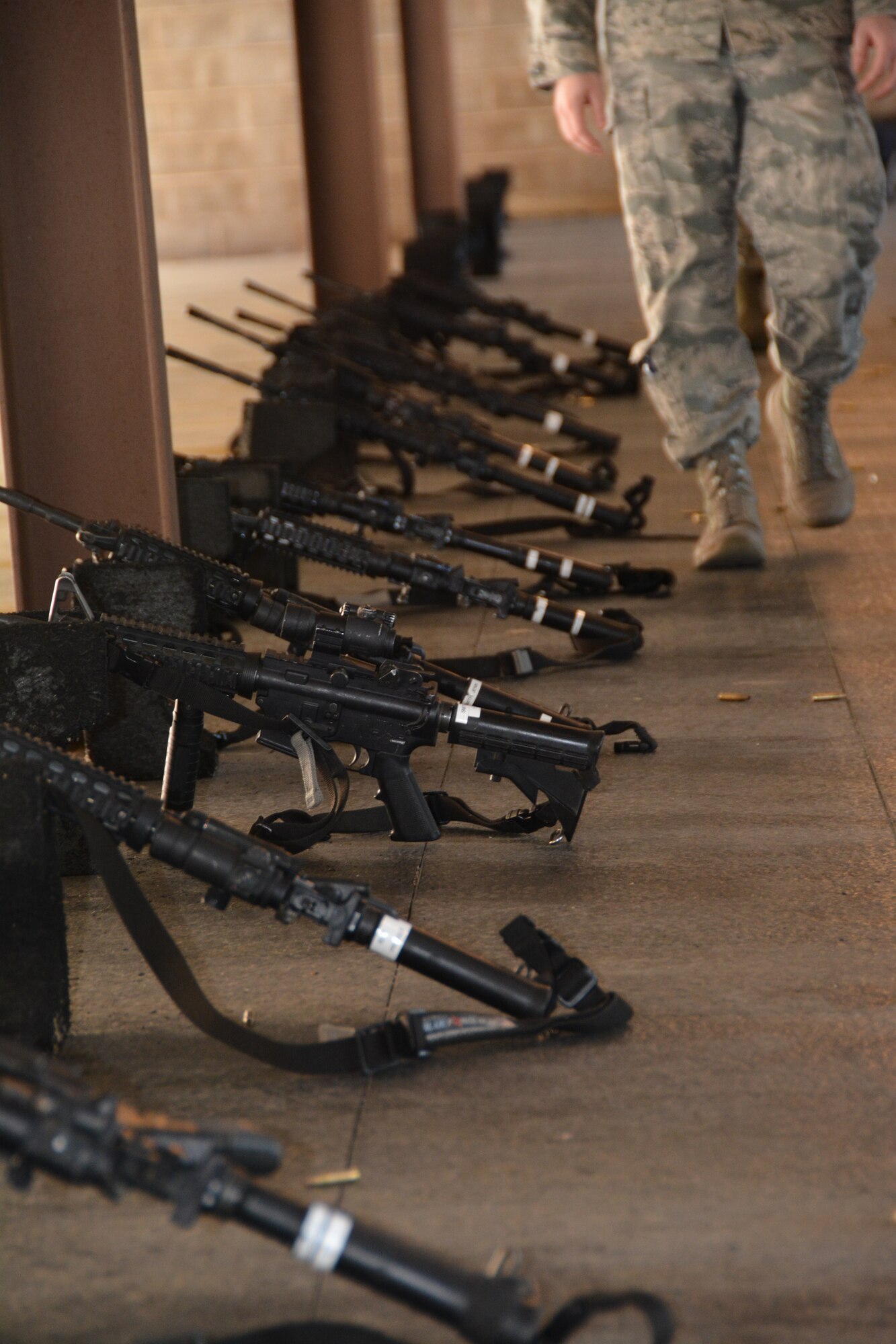 Four Combat Arms Training and Maintenance instructors from the 507th Security Forces Squadron walk out to check targets at the firing range after Airmen fire their M-4 carbines during weapons qualification Oct. 3, 2015, at Tinker Air Force Base, Okla. Reservists interested in joining the Security Forces career field are eligible to receive an enlistment bonus of up to $20,000 for committing to a six-year enlistment, and prior-service Airmen interested in retraining into the field are eligible for a bonus of up to $15,000. (U.S. Air Force photo by Tech. Sgt. Lauren Gleason)
