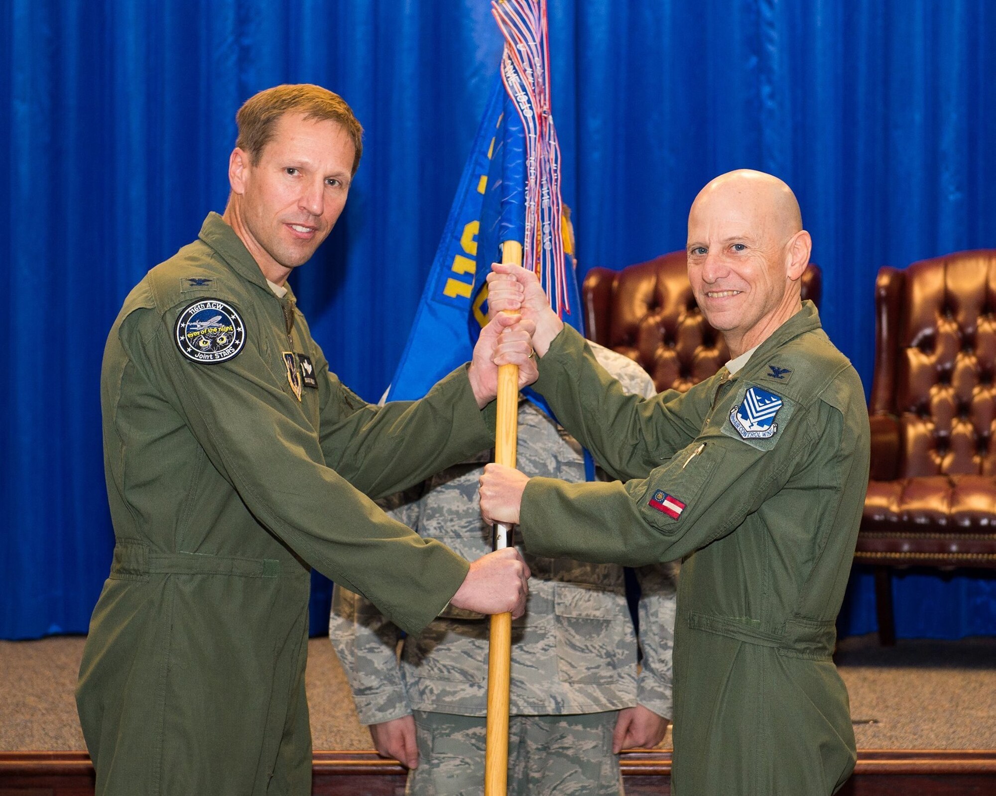 U.S. Air Force Col. Louis Perino, right, the commander of the 116th Medical Group, Georgia Air National Guard, receives the unit guidon from Col. Mark Weber, the commander of the 116th Air Control Wing, during a change of command ceremony at Robins Air Force Base, Ga., Jan. 10, 2016. A board certified emergency medicine physician, Perino replaced Col. Muriel Herman who commanded the group for more than six years. Perino is also the Chief of Aerospace Medicine and the Deputy State Air Surgeon for the Georgia Air National Guard and brings 23 years of Air National Guard and a wealth of civilian experience to the position. (U.S. Air National Guard photo by Senior Master Sgt. Roger Parsons)