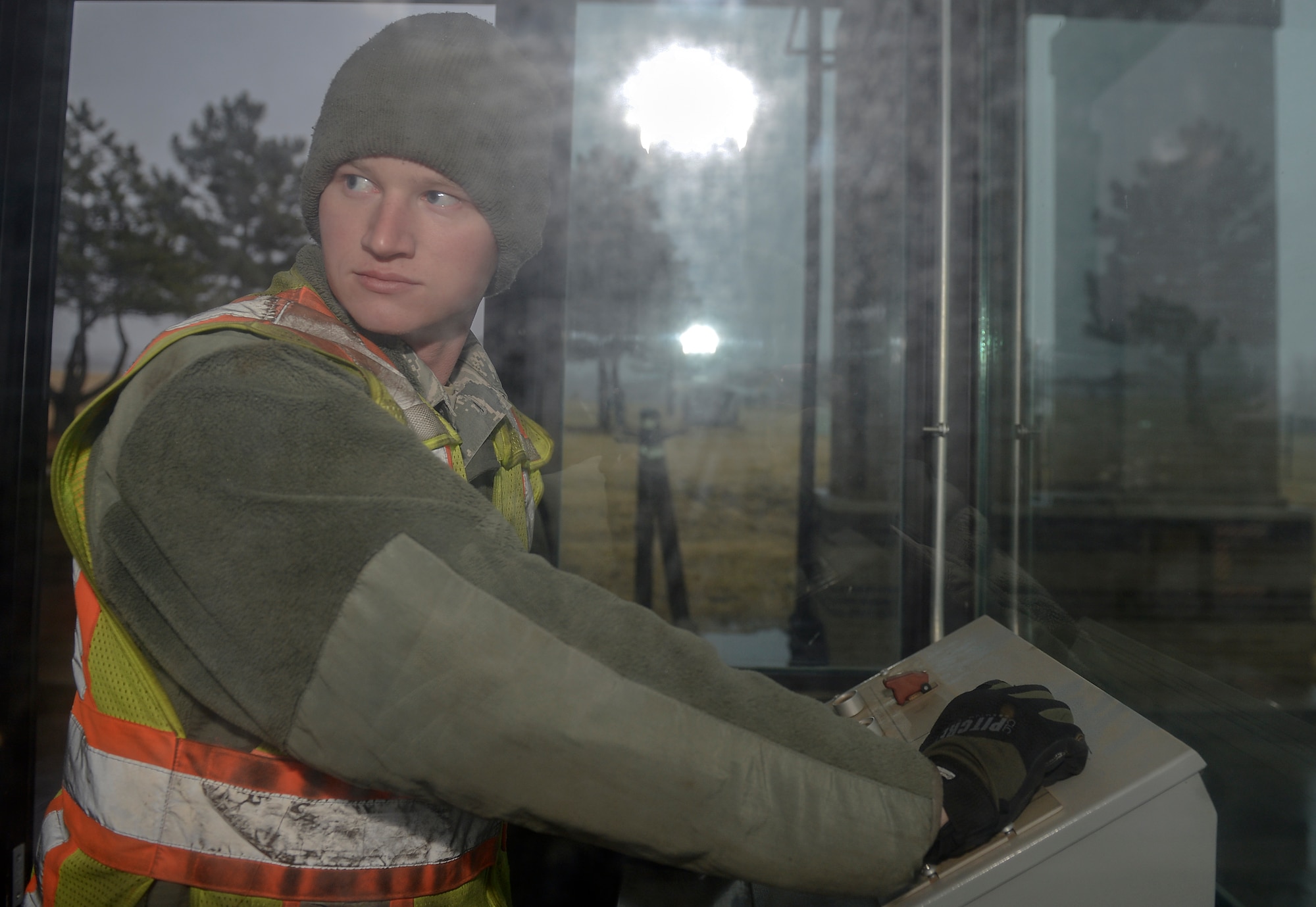 Airman 1st Class John Chaney, 22nd Civil Engineer Squadron electrical power production, uses the control panel to test road barriers, Jan. 7, 2016, at McConnell Air Force Base, Kan. Chaney worked with other 22nd CES Airmen to ensure all parts of the barriers work properly. (U.S. Air Force photo/Senior Airman Colby L. Hardin)

