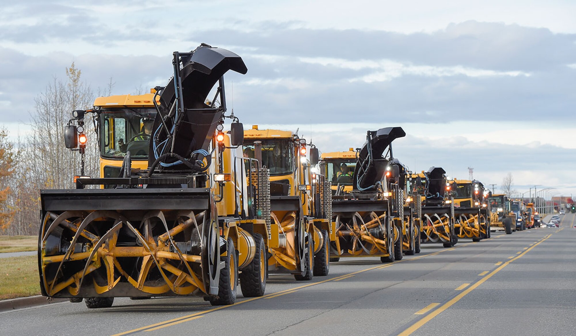 The 773rd Civil Engineer Squadron conducts the annual Snow & Ice Parade on Joint Base Elmendorf-Richardson, Alaska, Oct. 9, 2015. The 773d CES snow barn Airmen work day and night ensuring that aircraft have a safe and visible runway to operate from. (U.S. Air Force photo by Alejandro Pena)