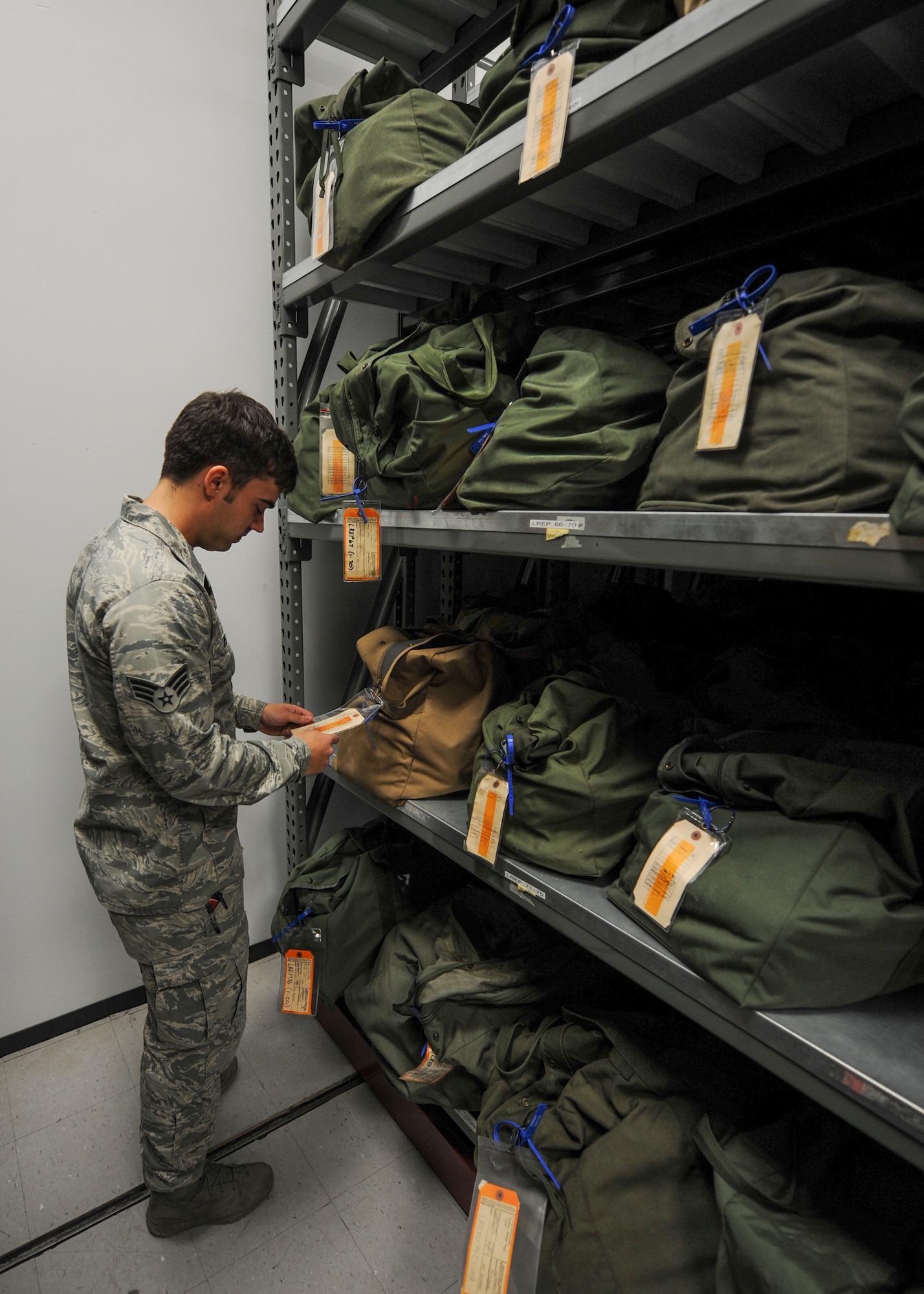 U.S. Air Force Senior Airman Ryan Petty, 19th Operations Support Squadron aircrew flight equipment journeyman, inspects an emergency passenger oxygen system Jan. 11, 2016, at Little Rock Air Force Base, Ark. Safety flight gear must be uploaded to aircraft prior to flight. (U.S. Air Force photo/Senior Airman Harry Brexel)