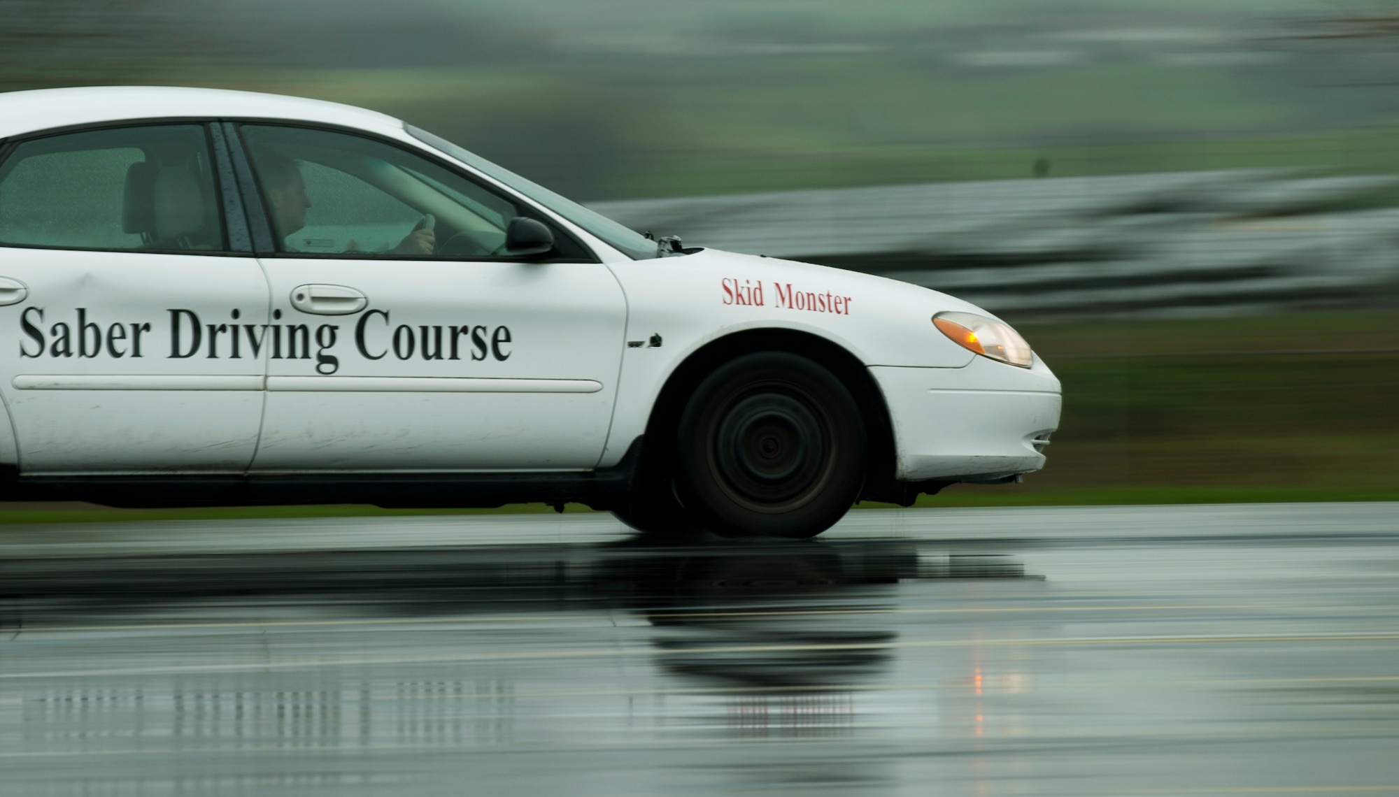 U.S. Air Force Tech. Sgt. Gregory Westmoreland, a 52nd Fighter Wing Safety occupational safety and health technician, drives a vehicle during a training session at the Saber Driving Course at Spangdahlem Air Base, Germany, Jan. 11, 2016. The driving course focuses on bringing awareness to drivers about speeding on icy road conditions. (U.S. Air Force photo by Airman 1st Class Timothy Kim/Released)