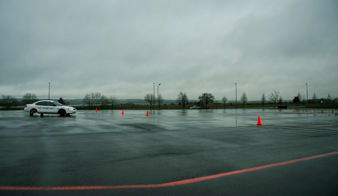 U.S. Air Force Tech. Sgt. Gregory Westmoreland, a 52nd Fighter Wing Safety occupational safety and health technician, drives a vehicle during a training session at the Saber Driving Course at Spangdahlem Air Base, Germany, Jan. 11, 2016. The driving course simulates operating a vehicle on icy roads within a controlled environment for learning. (U.S. Air Force photo by Airman 1st Class Timothy Kim/Released)