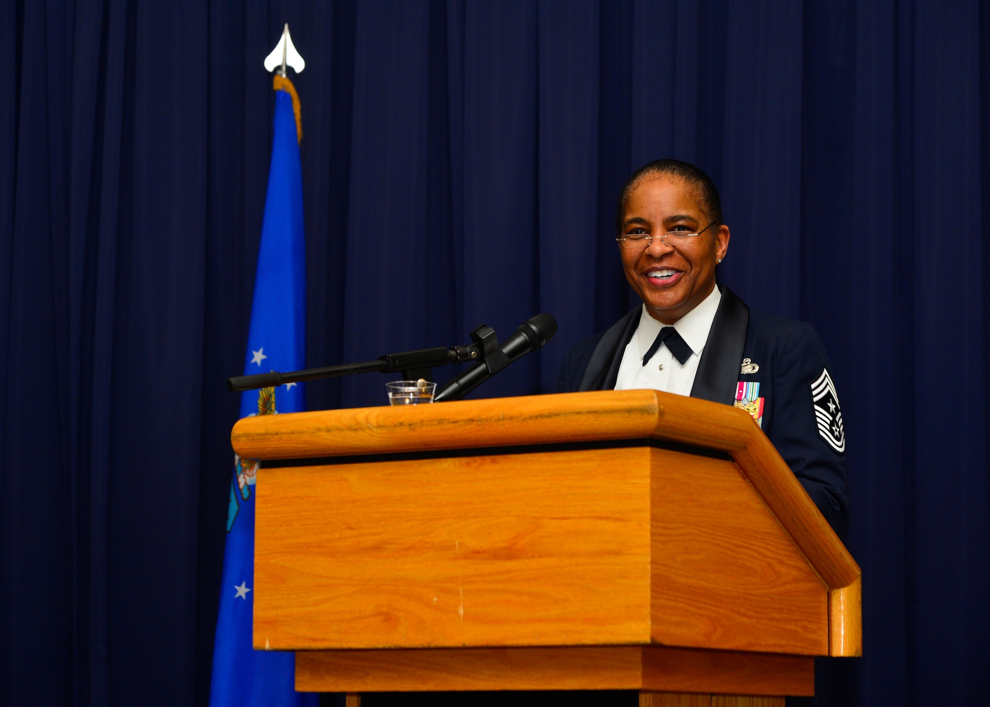Chief Master Sgt. Shelina Frey, Air Mobility Command command chief, speaks during the Dover Chief Induction Ceremony Jan. 9, 2016, at the Landings on Dover Air Force Base, Del. Frey was invited to be the guest speaker at the event where Team Dover’s newest chief master sergeants and chief master sergeant-selects were recognized. (U.S. Air Force photo/Senior Airman William Johnson)