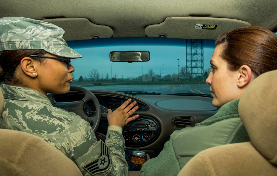 U.S. Air Force Staff Sgt. Brittany McGill, left, instructs U.S. Air Force Staff Sgt. Jessica Morgan, both 52nd Fighter Wing Safety occupational safety and health technicians, during a training session at the Saber Driving Course at Spangdahlem Air Base, Germany, Jan. 8, 2016. New technicians and points-of-contact must undergo the Saber Driving Course training program to better instruct Airmen during the actual training class. (U.S. Air Force photo by Airman 1st Class Timothy Kim/Released)