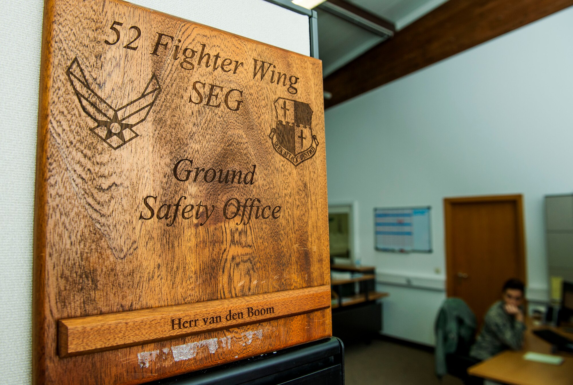 The 52nd Fighter Wing Ground Safety Office sign is displayed in their building before a training session at Spangdahlem Air Base, Germany, Jan. 8, 2016. The office runs the Saber Driving Course program, which trains Airmen how to operate vehicles during dangerous road conditions. (U.S. Air Force photo by Airman 1st Class Timothy Kim/Released)