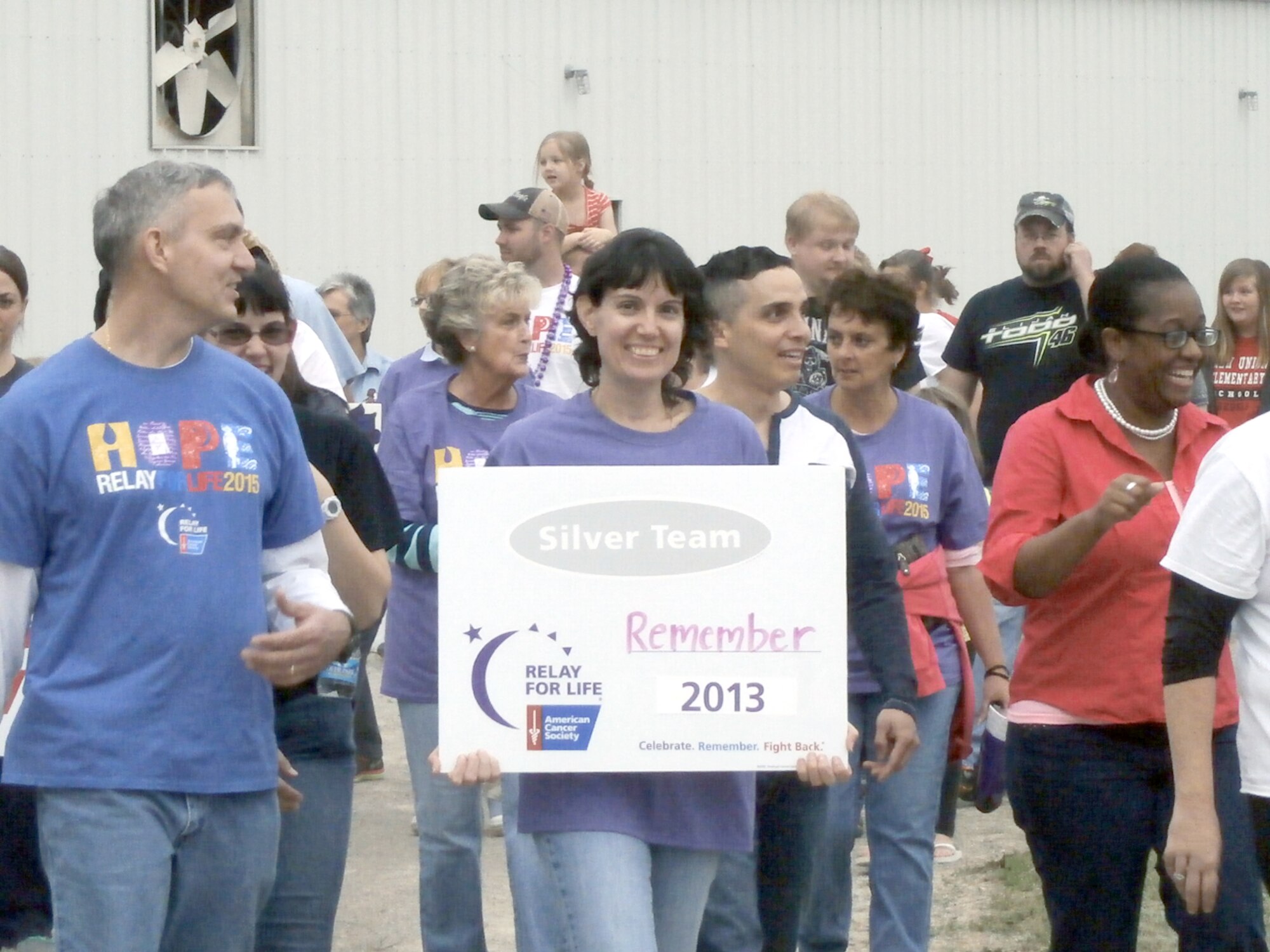 Shawn and Dee Wolfe, co-captains of Team REMEMBER, a Relay for Life team organized by AEDC employees, make laps around the track at the Coffee County Fairgrounds as part of the Relay for Life event. (Courtesy photo)