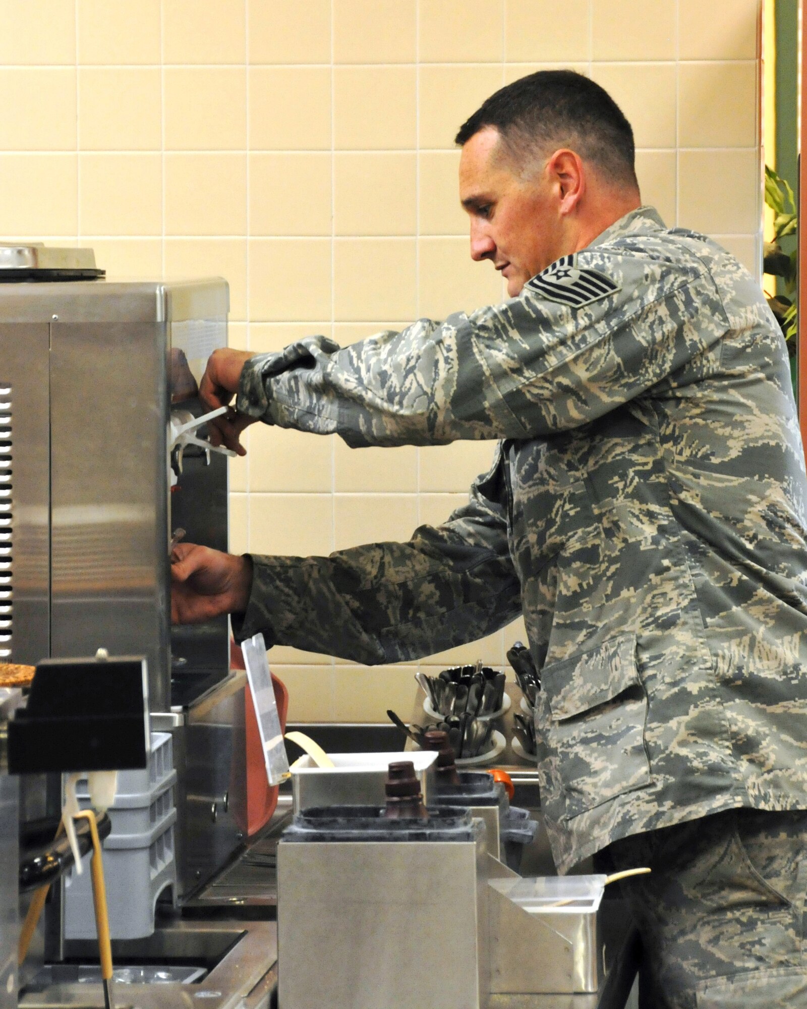 Tech. Sgt. Xander English fills a bowl with soft serve ice cream while having lunch in the dining facility during the unit’s regularly schedule drill weekend Nov. 8, 2015. Although a “red” food item, ice cream is available and will not be going away.  (U.S. Air National Guard photo by Tech. Sgt. Michael Touchette/Released)