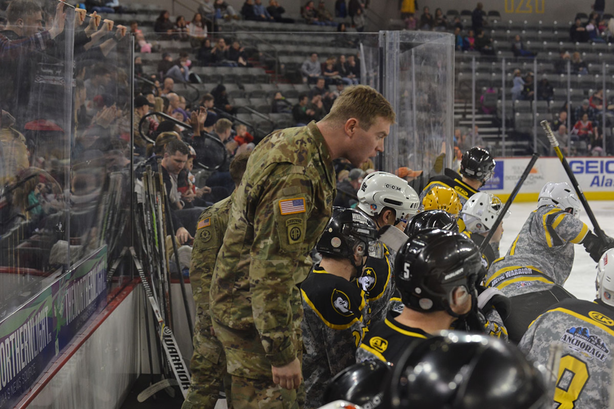 Joint Base Elmendorf-Richardson's Army hockey coach yells some encouragement at his team during JBER's Air Force vs. Army hockey match at the Sullivan Arena, Jan 9. The Army came back from a 4-1 point deficit to win the game in a shoot-out and a final score of 7-6. (Air Force photo by Airman 1st Class Kyle Johnson/Released)